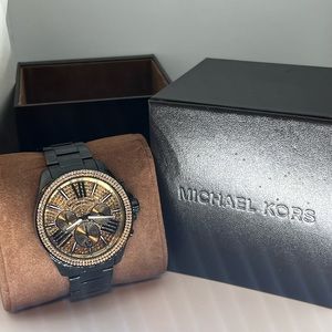 Like new worn less than 5 times. Michael Kors watch does need a new battery.